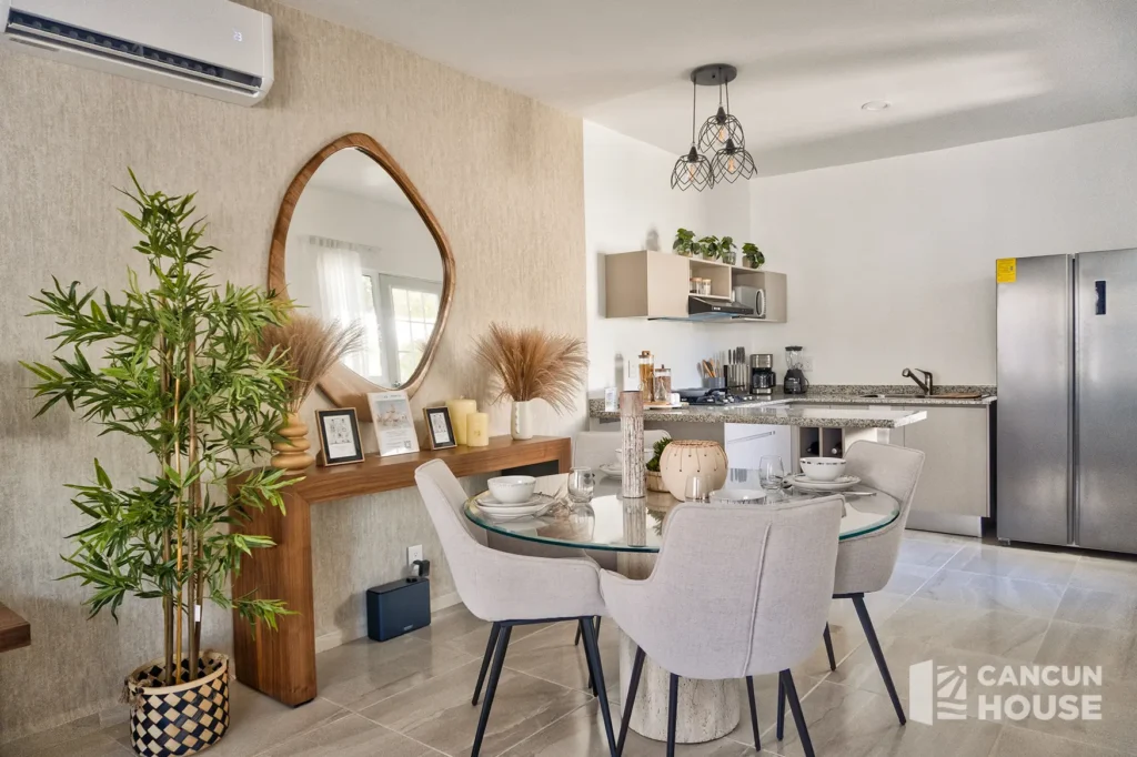 View from the dining room towards the kitchen in a Kitam Mayakoba home.
